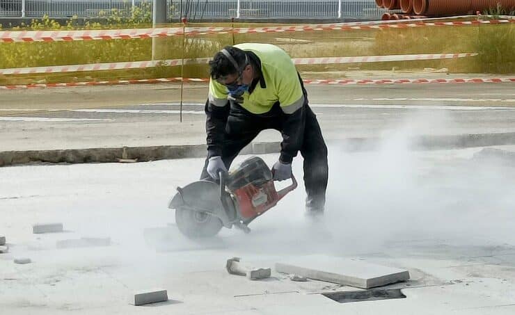 man-using-cutting-concrete-floor-with-diamond-saw-blade-machine_27550-1699